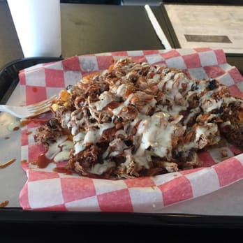 Leon's Smoke Shack BBQ - Half of potato with brisket and pulled pork. - Barbeque Near Me - Tulsa, Oklahoma Leon's Smoke Shack BBQ - Half of potato with brisket and pulled pork. - Barbeque Near Me - Tulsa, Oklahoma