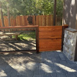 Added height to the shared fence line, built a redwood gate, and enclosed the remainder of the yard with hog wire fencing. Added height to the shared fence line, built a redwood gate, and enclosed the remainder of the yard with hog wire fencing.