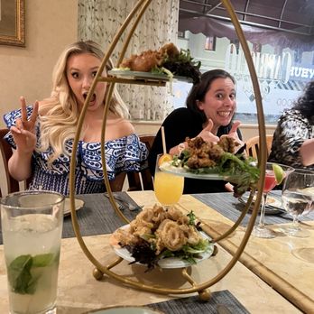 Capriccio Grill - A fried seafood appetizer combo with funny friends - Steakhouses Near Me - Memphis, Tennessee