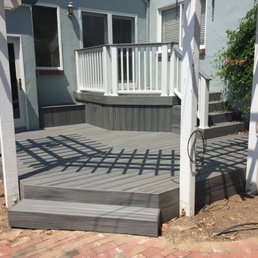 Great deck built by Carpenter Construction. Note that the trellis and posts were already there from previous deck.