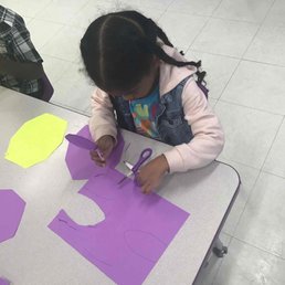 Learning how to use scissors.