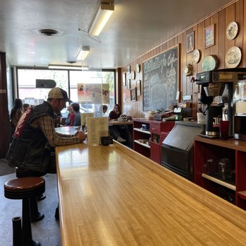 Willalby's Cafe - a man sitting at the bar - Breakfast & Brunch Near Me - Madison, Wisconsin
