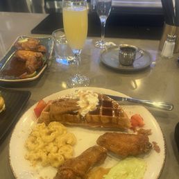 Half biscoff waffle, Mac n cheese, honey old bay wings, and peach mimosa! Half biscoff waffle, Mac n cheese, honey old bay wings, and peach mimosa!