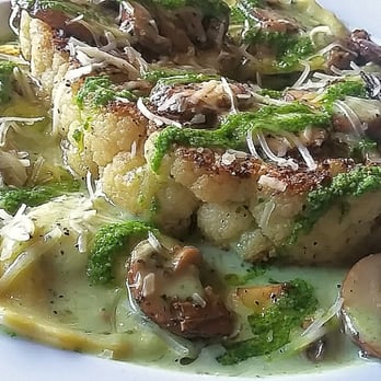 The Whiskey Kitchen - Cauliflower Ravioli with a pesto cream sauce and cauliflower steak in the middle. So delicious! - Gastropubs Near Me - Virginia Beach, Virginia The Whiskey Kitchen - Cauliflower Ravioli with a pesto cream sauce and cauliflower steak in the middle. So delicious! - Gastropubs Near Me - Virginia Beach, Virginia