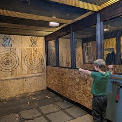 Axe Me Out - Kid throwing a throwing star