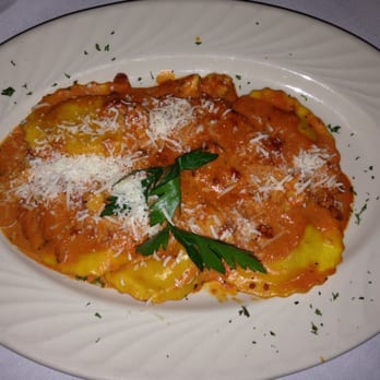 Arabellas - Ravioli All'Astice. Fresh made Ravioli stuffed with lobster meat ,roasted garlic in saffron dough w/ light tomatoe cream sauce. - Italian Near Me - Winter Haven, Florida Arabellas - Ravioli All'Astice. Fresh made Ravioli stuffed with lobster meat ,roasted garlic in saffron dough w/ light tomatoe cream sauce. - Italian Near Me - Winter Haven, Florida