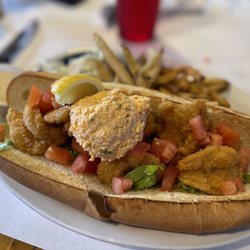 Salty Papa's Shrimp House - Shrimp po-boy sandwich  with a scoop of palmetto cheese on top.