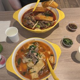 Signature Bone Broth (Medium) and Sichuan Mini Hotpot soups Signature Bone Broth (Medium) and Sichuan Mini Hotpot soups