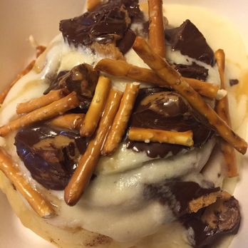 Cinnaholic - Sun Devil Roll (vanilla frosting, peanut butter cups and pretzel sticks) - Bakeries Near Me - Gilbert, Arizona Cinnaholic - Sun Devil Roll (vanilla frosting, peanut butter cups and pretzel sticks) - Bakeries Near Me - Gilbert, Arizona