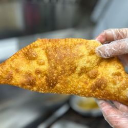 Cheburek, crispy dough filled with beef, onions.