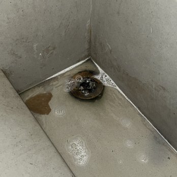 Buffalo Wild Wings - Decaying drain from rust and backwash - Chicken Wings Near Me - Santa Ana, California