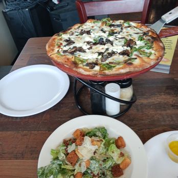Milan’s Wood Fired Pizza - Traditional Caesar Salad, Truffle (SM)pizza with a nice glass of wine ! - Pizza Near Me - Hammond, Louisiana Milan’s Wood Fired Pizza - Traditional Caesar Salad, Truffle (SM)pizza with a nice glass of wine ! - Pizza Near Me - Hammond, Louisiana