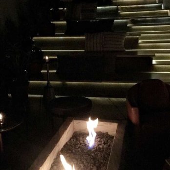 Ysabel - Hang out area on the steps with pillows in front of the fire pit - so cute! - New American Near Me - West Hollywood, California