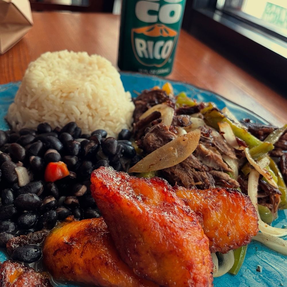Cafecito - Vaca Frita with onions and pepper, rice, black beans and maduros. - Cuban Near Me - Chicago, Illinois Cafecito - Vaca Frita with onions and pepper, rice, black beans and maduros. - Cuban Near Me - Chicago, Illinois