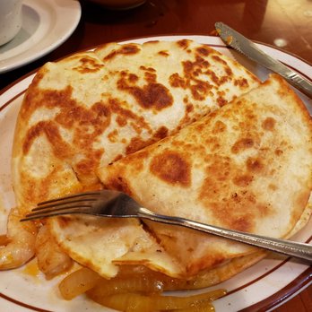 El Rancho Grande - a quesadilla on a plate with a fork - Mexican Near Me - Wetumpka, Alabama El Rancho Grande - a quesadilla on a plate with a fork - Mexican Near Me - Wetumpka, Alabama