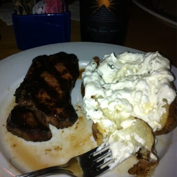 Scotch 'N Sirloin - Sirloin cooked medium well with a baked potato side (sour cream and butter!) - Steakhouses Near Me - Dewitt, New York Scotch 'N Sirloin - Sirloin cooked medium well with a baked potato side (sour cream and butter!) - Steakhouses Near Me - Dewitt, New York