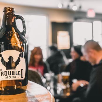 Troubled Monk Brewery - a beer bottle on a table - Breweries Near Me - Red Deer, Alberta