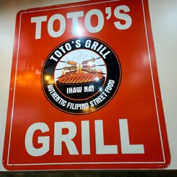 Toto's Grill dining room sign. Toto's Grill dining room sign.