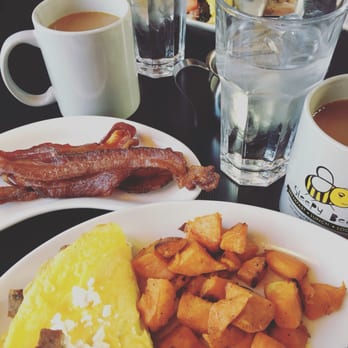 Sleepy Bee Cafe - Oakley - Melted leek and sausage omelet, roasted sweet potatoes and a side of bacon. - Breakfast & Brunch Near Me - Cincinnati, Ohio Sleepy Bee Cafe - Oakley - Melted leek and sausage omelet, roasted sweet potatoes and a side of bacon. - Breakfast & Brunch Near Me - Cincinnati, Ohio