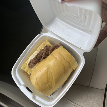 Pasquale's Pizza - a person holding a sandwich in a styrofoam container - Pizza Near Me - Greenville, Mississippi Pasquale's Pizza - a person holding a sandwich in a styrofoam container - Pizza Near Me - Greenville, Mississippi
