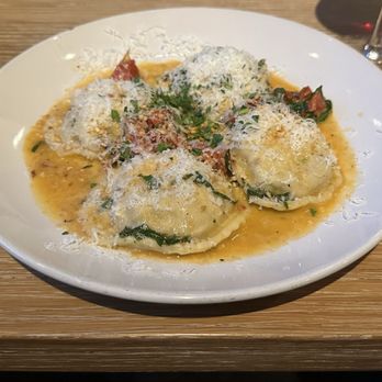 Republic Texas Tavern - ITALIAN BRAISED PORK RAVIOLI House made Italian Pork Ravioli w/Oven Dried Tomato & Spinach, White Wine Garlic Sauce, Fresh Herbs & Parmesan - New American Near Me - Dallas, Texas Republic Texas Tavern - ITALIAN BRAISED PORK RAVIOLI House made Italian Pork Ravioli w/Oven Dried Tomato & Spinach, White Wine Garlic Sauce, Fresh Herbs & Parmesan - New American Near Me - Dallas, Texas