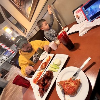 Napoli Pizza - two boys sitting at a table with plates of food - Pizza Near Me - Wallingford, Connecticut