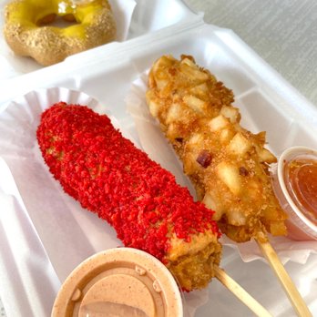 Mochinut Plainfield - Two Korean Hotdogs (Potato and Hot Cheetoz) each hotdog comes with 1 side of sauce (we got sweet & sour and yum yum). - Donuts Near Me - Plainfield, Indiana