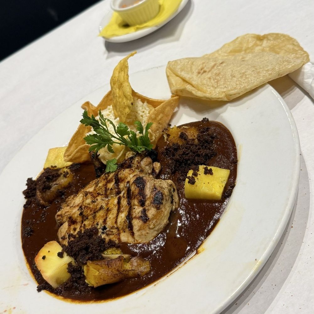 Manchamanteles Restaurant - MOLE MANCHAMANTELES* (P, N) abf chicken breast, mole rojo, pineapple, plantains, chorizo, mashed potatoes 32 - Mexican Near Me - Chicago, Illinois Manchamanteles Restaurant - MOLE MANCHAMANTELES* (P, N) abf chicken breast, mole rojo, pineapple, plantains, chorizo, mashed potatoes 32 - Mexican Near Me - Chicago, Illinois