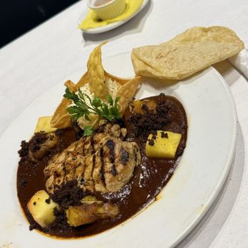 Manchamanteles Restaurant - MOLE MANCHAMANTELES* (P, N) abf chicken breast, mole rojo, pineapple, plantains, chorizo, mashed potatoes 32 - Mexican Near Me - Chicago, Illinois