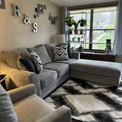 Warehouse Furniture - Sofa, swivel chair, ottoman and rug.