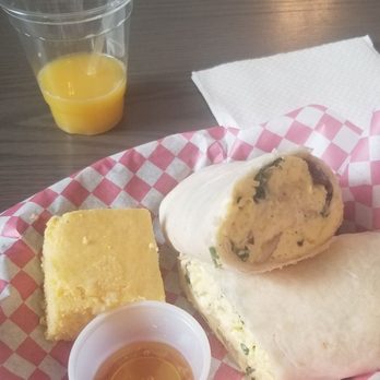 West End - Breakfast Burrito served with cornbread and honey. With a Screwdriver drink. - Cafes Near Me - Marion, Iowa