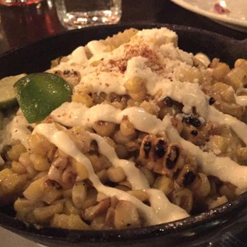 Poquitos - Grilled Corn-Sliced off the cob with crema, lime, cotija & chile pequin. - Mexican Near Me - Seattle, Washington