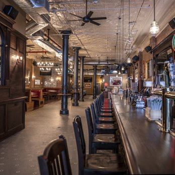 Bleecker Street Bar - a row of bar stools - Sports Bars Near Me - New York, New York Bleecker Street Bar - a row of bar stools - Sports Bars Near Me - New York, New York