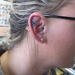 Piercing on my ear in my tattoo Piercing on my ear in my tattoo