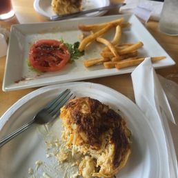 Partially eating crab cake platter. Partially eating crab cake platter.