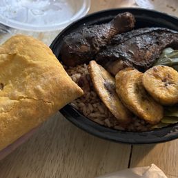 jerk chicken, coconut rice and peas, collard greens, beef patty