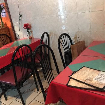 Taqueria Guadalupe - tables and chairs in a restaurant - Mexican Near Me - New York, New York Taqueria Guadalupe - tables and chairs in a restaurant - Mexican Near Me - New York, New York