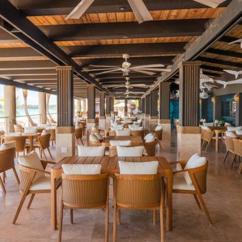 Ocean Lab Taproom - A beachfront dining area with open-air seating, ocean views, and a relaxed coastal atmosphere. - Breweries Near Me - Carolina, Puerto Rico Ocean Lab Taproom - A beachfront dining area with open-air seating, ocean views, and a relaxed coastal atmosphere. - Breweries Near Me - Carolina, Puerto Rico