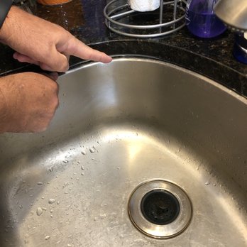 Fixer - Showing the gap between the countertop and the under mount sink where water could leak. - Handyman Near Me - Arlington Heights, Illinois Fixer - Showing the gap between the countertop and the under mount sink where water could leak. - Handyman Near Me - Arlington Heights, Illinois