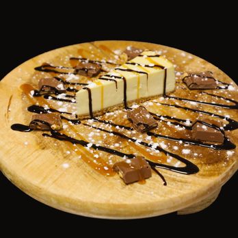 Safari Secrets - a dessert on a wooden plate - African Near Me - Oshawa, Ontario Safari Secrets - a dessert on a wooden plate - African Near Me - Oshawa, Ontario