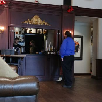 Music Box Theatre Lounge - two people standing in front of a bar - Lounges Near Me - Chicago, Illinois Music Box Theatre Lounge - two people standing in front of a bar - Lounges Near Me - Chicago, Illinois