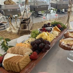 Bless My Soul Food Catering & More - Fruit and cheese charcuterie. Parfait bar (vanilla Yoghurt, blueberries, pineapple strawberries and granola.