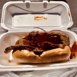 Two Brothers BBQ - Brisket sandwich with mild sauce. Next time I will get sauce on the side. Meat was substantial portion. You won't be hungry.