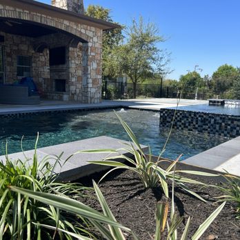Torres Lawn Care - Raised steel beds to line up perfectly with the pool, metal trellis with star jasmine and DG for dog area with turf - Landscaping Near Me