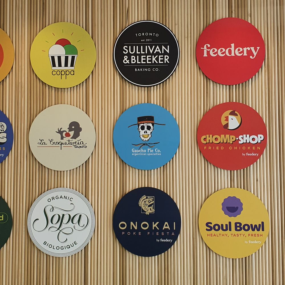Feedery - a variety of beer coasters on a wall - Food Court Near Me - Aurora, Ontario Feedery - a variety of beer coasters on a wall - Food Court Near Me - Aurora, Ontario