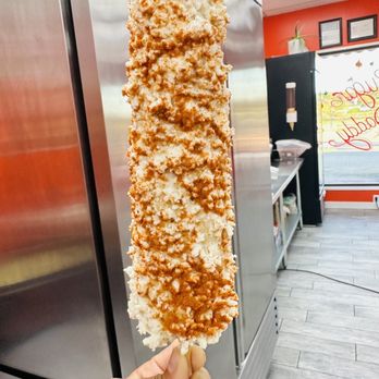 Sugar Daddy Snack Attack - a hand holding a piece of food - Desserts Near Me - San Antonio, Texas