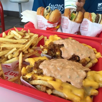 In-N-Out Burger - Various cheeseburgers and burgers with 2 animals fries and 1 regular fries - Burgers Near Me - Austin, Texas