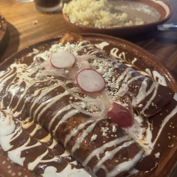 Rosa Madera - Chicken Mole enchiladas with garlic butter and beans - Mexican Near Me - Sacramento, California Rosa Madera - Chicken Mole enchiladas with garlic butter and beans - Mexican Near Me - Sacramento, California