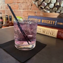 Empress Gin with tonic. It's a beautiful purple gin with a very unique flavor. Alex made it perfectly!