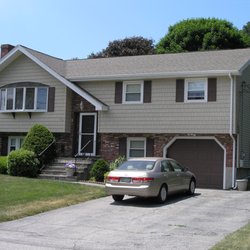 TKD Construction - The owner of this house wanted a new roof installed before it started leaking and new vinyl siding, windows, and front door with sidelites.